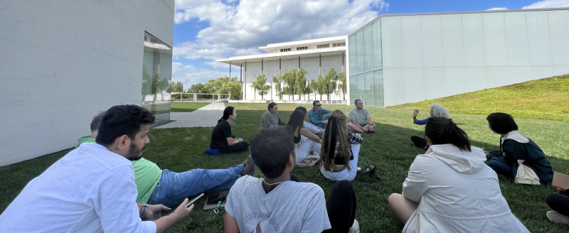 A class on the grassy lawn outside the Kennedy Center REACH expansion