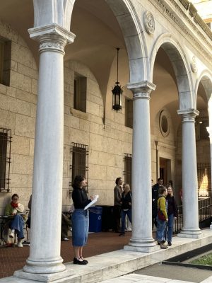 Marie Zenzie sketching in the courtyard of the Boston Public Library.